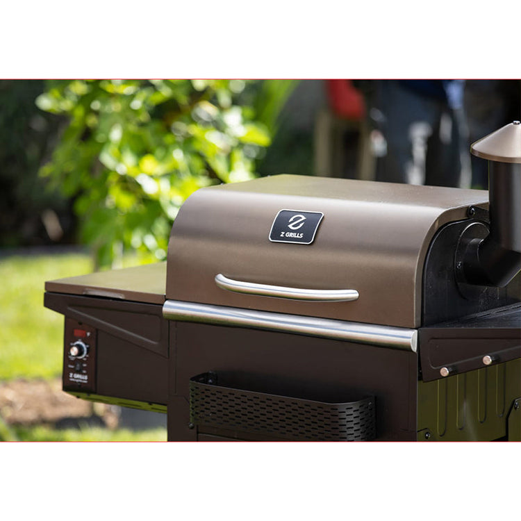 Outdoor grill with a brand logo on a blurred natural background
