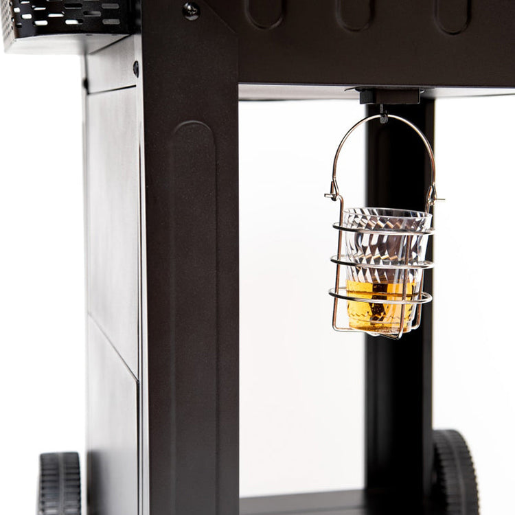 Close-up of a coffee machine with a glass carafe containing coffee.