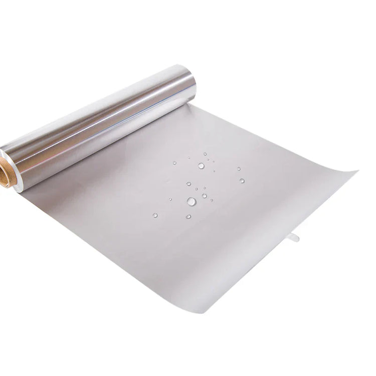 Roll of silver reflective material with bubbles on a white background