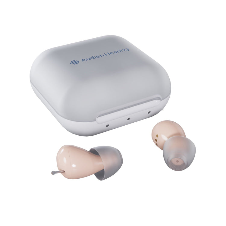 Pair of hearing aids with their charging case on a white background, featuring the Audien Hearing logo.