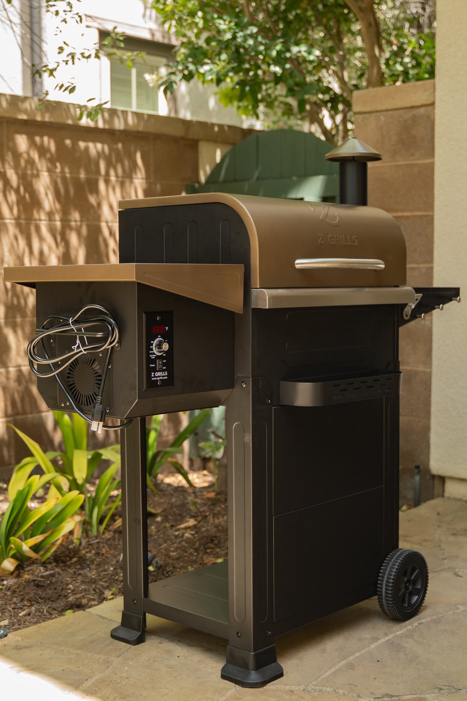 Barbecue grill on a patio with outdoor furniture in the background