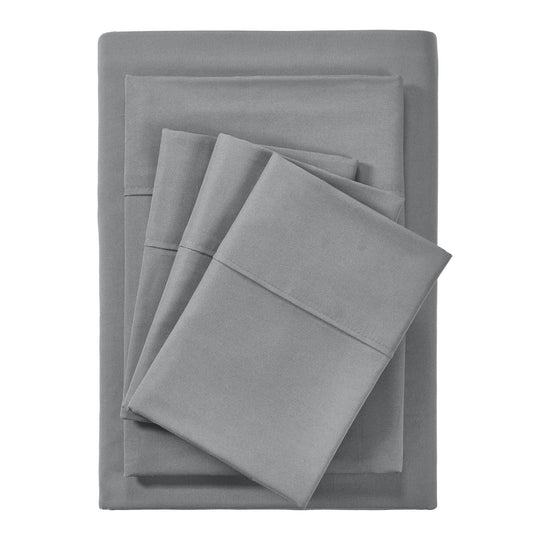 A charcoal grey 6 piece bamboo sheet set displayed on a bed, including a fitted sheet, a flat sheet, and pillow covers with a second pillow placed on the bed.