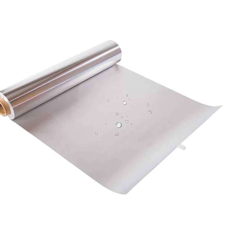 Roll of silver reflective material with bubbles on a white background
