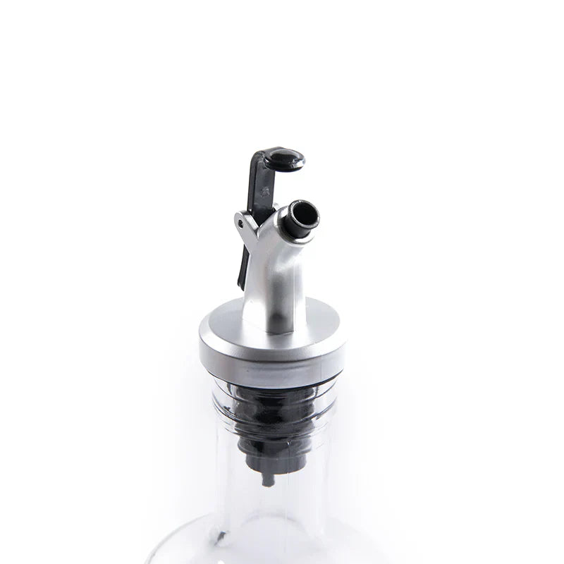 Clear glass bottle with a metal cap on a white background