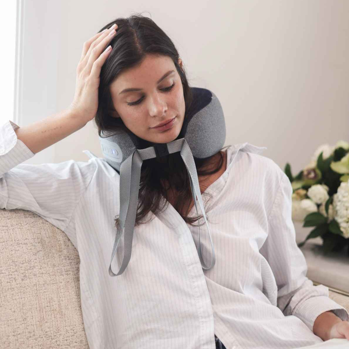 Woman using a neck pillow in a home setting
