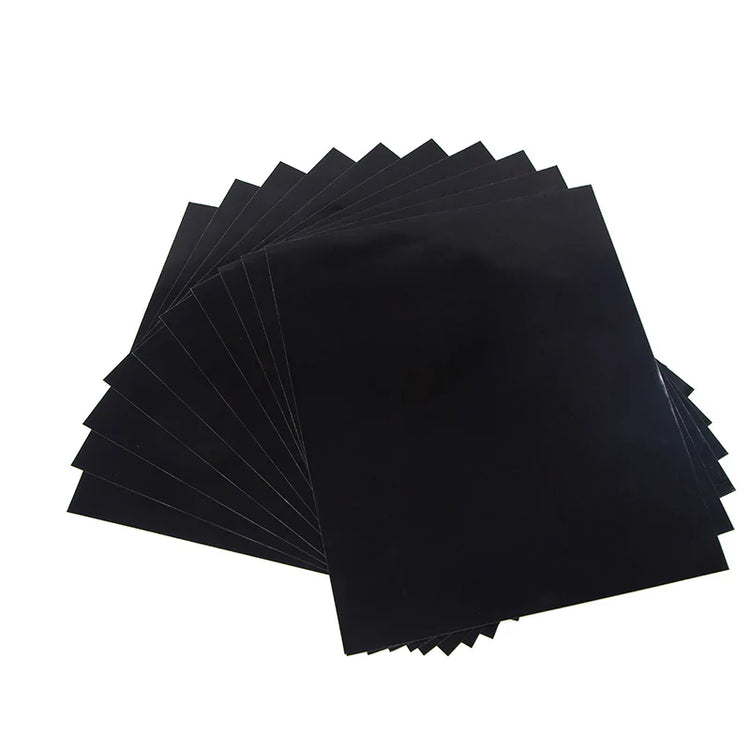 Stack of black sheets on a white background