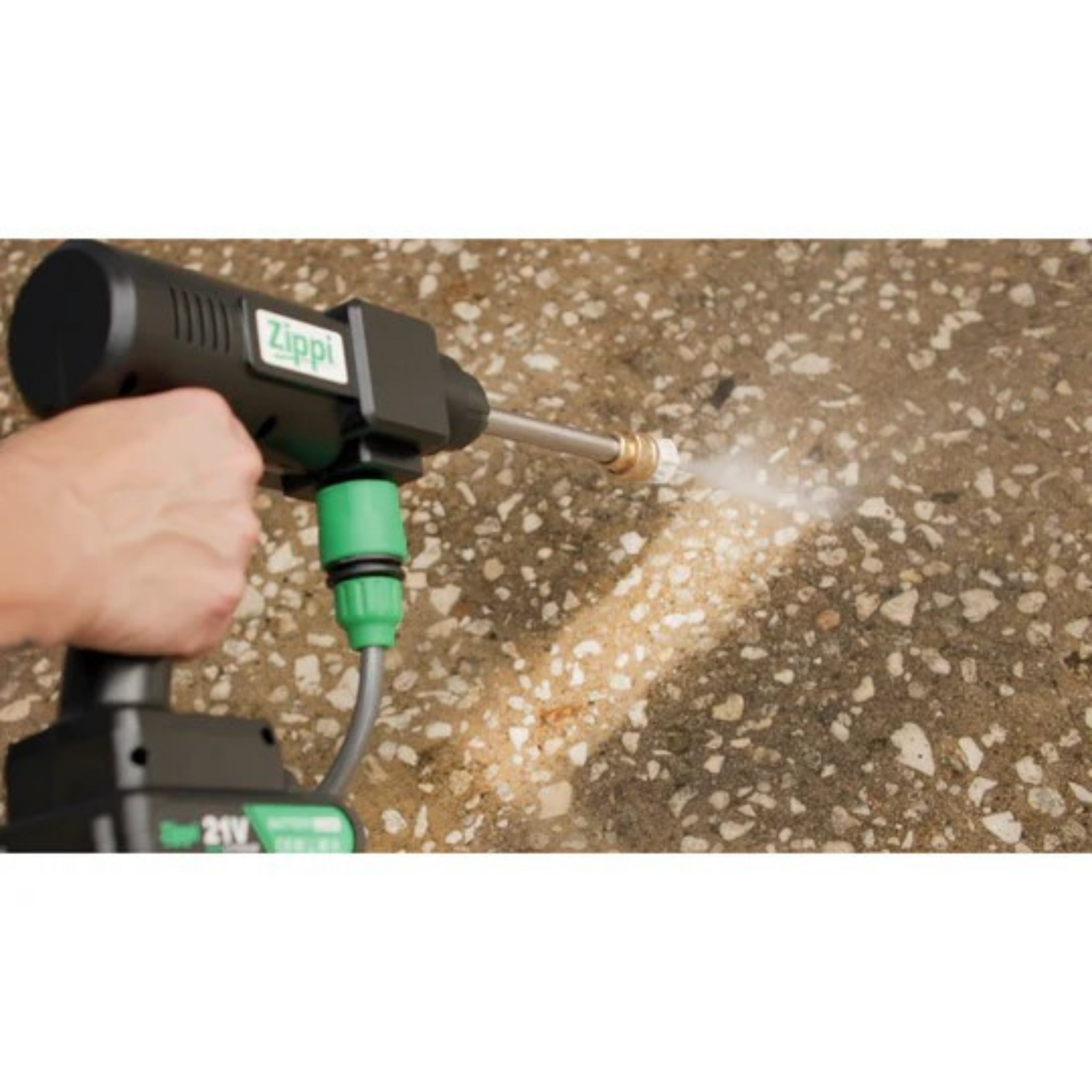 Person using a Zippi pressure washer on a concrete surface