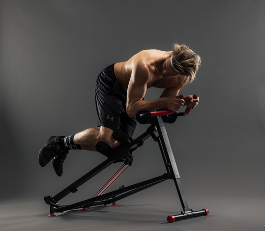 Black and red exercise machine on a gray background