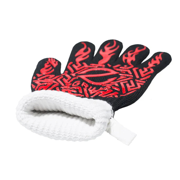 Glove with red flame pattern and white cuff on a white background