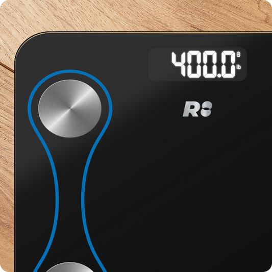 A black digital smart scale with blue decorative elements and silver brand logos, displaying a weight reading.