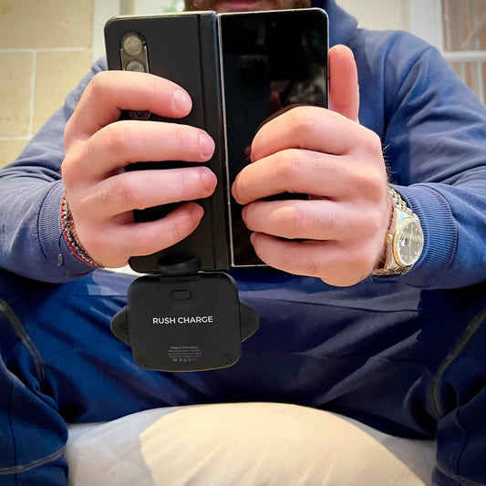 Four rectangular black portable power banks with a green 'R' logo on the front, arranged horizontally.