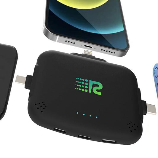 Four portable battery chargers in different colors: pink, blue, white, and black, each with a label displaying the brand.