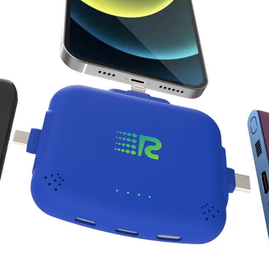 Four portable battery chargers in different colors: pink, blue, white, and black, each with a label displaying the brand.