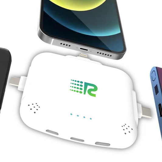 Four portable battery chargers in different colors: pink, blue, white, and black, each with a label displaying the brand.