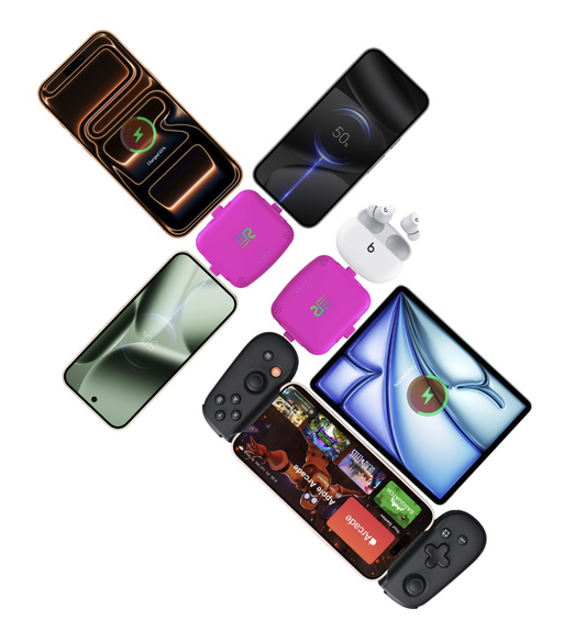 Four small electronic trackers in different colors (gray, mint green, pink, and white) lined up in a row against a plain white background.